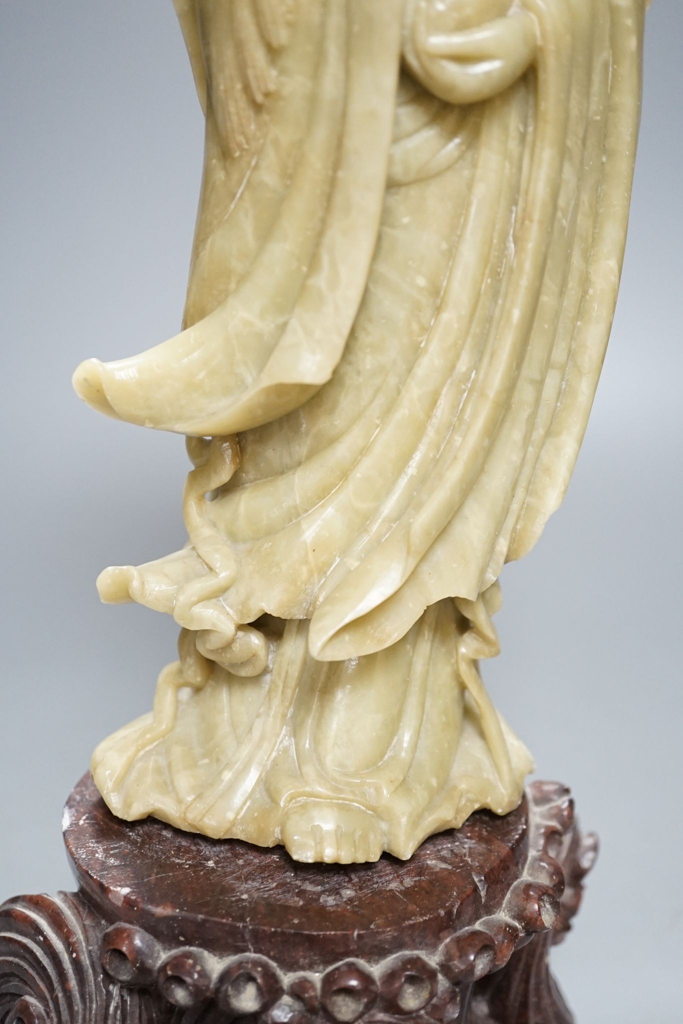 A large Chinese soapstone figure of Guanyin, on base, 40cm